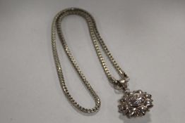 A STERLING SILVER SUN PENDANT ON SILVER CHAIN APPROX WEIGHT - 16.1G