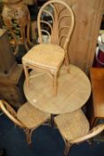 A MODERN WICKER EFFECT CONSERVATORY TABLE AND FOUR CHAIRS