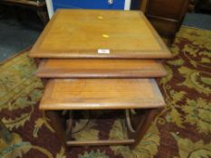 A RETRO 'G-PLAN' TEAK NEST OF TABLES
