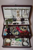 A LEATHER JEWELLERY BOX AND CONTENTS