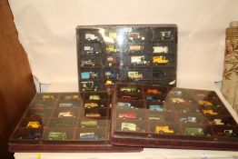 THREE PLASTIC DISPLAY CASES CONTAINING DIE CAST TOY CARS
