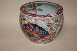 AN ORIENTAL CERAMIC FISH BOWL WITH CHARACTER MARKS TO BASE A/F