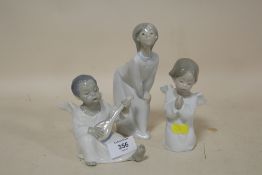 TWO LLADRO CHERUB FIGURES TOGETHER WITH A LLADRO FIGURE OF A COLONEL