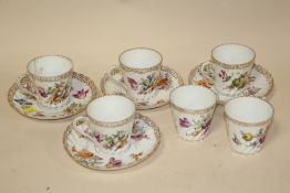 A COLLECTION OF FLORAL DRESDEN CHINA CUPS AND SAUCERS A/F