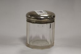 A HALLMARKED SILVER TOPPED VANITY JAR