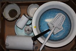 A TRAY OF ENAMELLED METALWARE