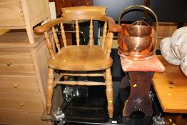A MODERN SMOKERS BOW ARMCHAIR, OAK STOOL AND A COAL HELMET (3)