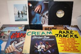 A COLLECTION OF LP RECORDS TO INCLUDE STATUS QUO, KISS, ACDC, PINK FLOYD ETC.
