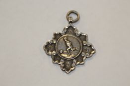 A HALLMARKED SILVER FOOTBALL INTEREST FOB MEDAL APPROX WEIGHT - 12.1G