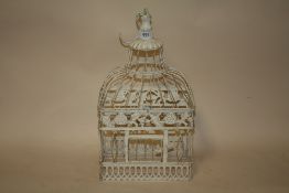 A SMALL MODERN DECORATIVE BIRD CAGE