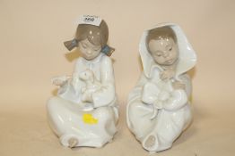 TWO NAO FIGURES OF YOUNG CHILDREN IN WHITE DRESSES