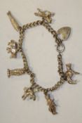 A STERLING SILVER CHARM BRACELET
