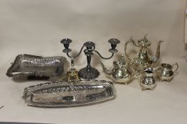 A BOX OF SILVER PLATED METALWARE TO INCLUDE A TEA SERVICE, CANDELABRA ETC.