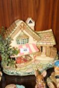 A COLLECTION OF PENDELFIN RABBITS FIGURES TOGETHER WITH A MARKET STALL SHAPED DISPLAY STAND (8 ITEMS