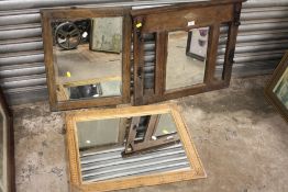AN OAK FRAMED HALL MIRROR WITH COAT HOOKS TO THE SIDES TOGETHER WITH A CANE EXAMPLE AND ANOTHER (3)