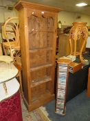 A SLIM PINE OPEN FLOORSTANDING BOOKCASE H-180 W-70 CM WITH A PINE CD RACK (2)