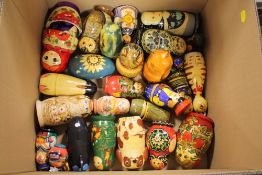 A COLLECTION OF WOODEN MATRYOSHKA RUSSIAN DOLLS