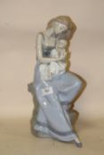 A LARGE NAO FIGURE OF A MOTHER AND CHILD, H 37 CM