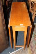 A RETRO TEAK DROPLEAF DINING TABLE