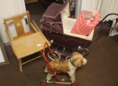 A COACH BUILT DOLLS PRAM with bedding and cover, together with a push-along dog and a 1950s child'