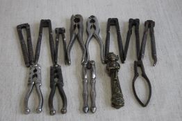 A COLLECTION OF ANTIQUE NUT CRACKERS, to include a brass Lincoln imp type