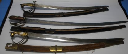 THREE INDIAN DRESS SWORDS, two with brass hilts, the other with inlaid wooden grip (3)