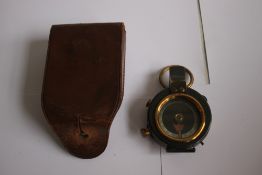 A FIRST WORLD WAR COMPASS in leather case