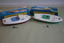 TWO BOXED SUTCLIFFE METAL CLOCKWORK SPEEDBOATS to include 'Commodore' in red and white with key