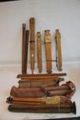 A TRAY OF VINTAGE OAK AND OTHER TRIPODS, to include cased examples A/F