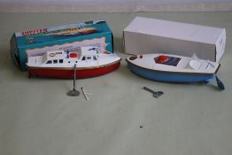 TWO SUTCLIFFE TINPLATE CLOCKWORK BOATS in original boxes to include 'Jupiter Ocean Pilot' in red and