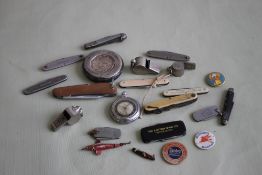 A BOX OF ASSORTED PEN KNIFE, BADGES, WHISTLES ETC., to include some advertising examples
