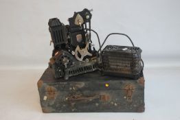 A CASED VINTAGE PATHESCOPE 9.5 CINE PROJECTOR with accessories