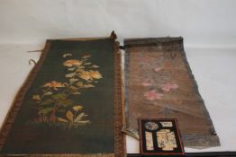 AN ORIENTAL SCROLL WITH EMBROIDERED DECORATION OF FLOWERS AND BUTTERFLIES, together with a painted