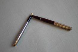 A PARKER SONNET FOUNTAIN PEN - stainless steel with gold fill trim together with a Parker 51