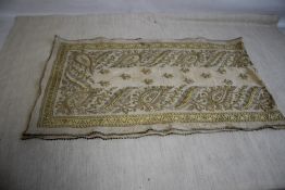 AN ANTIQUE MIDDLE EASTERN DOWRY SHAWL/CLOTH DECORATED WITH HEAVY EMBROIDERED GOLD AND SILVER WIRE