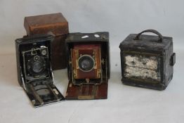 A SANDERSONS PATENT FOLDING CAMERA A/F, together with two other folding cameras