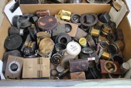 A TRAY OF ASSORTED VINTAGE PHOTOGRAPHIC LENSES, FILTER HOLDERS ETC.