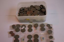 A TUB OF BRITISH AND WORLD COINS, to include a selection of half Crowns