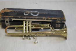 A VINTAGE CORTON BRASS TRUMPET, with original case, trumpet length 50 cm
