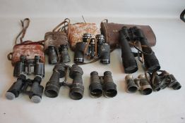 A GROUP OF VARIOUS BINOCULARS MOSTLY A/F, to include Telstar 45 x 70, and military types