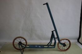 A VINTAGE CHILD'S BLUE PAINTED TWO WHEEL SCOOTER, with solid rubber tyres