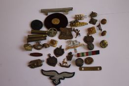 A BOX OF MILITARY BADGES AND BUTTONS, to include a black wound badge