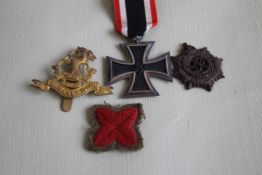 A WWII GERMAN IRON CROSS, 2nd class on ribbon and minor British badges