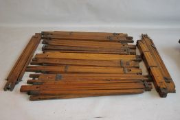A TRAY OF VINTAGE OAK TRIPODS, approx. twenty five to include Ensign examples A/F