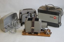 THREE VINTAGE SLIDE PROJECTORS to include an Opticis 100, Prinz Lancer II and a Eumig Mark 8