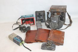 A RED BOX OF ASSORTED VINTAGE PHOTOGRAPHIC EQUIPMENT to include an Ensign 'Super Kinecam Sixteen'