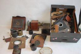 A LARGE COLLECTION OF ASSORTED VINTAGE PHOTOGRAPHIC AND MAGIC LANTERN LENSES, PLATES ETC.