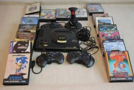 A SEGA MEGA DRIVE GAMES CONSOLE to include Sonic, PGA Tour Golf etc.