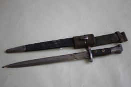 AN 1888 PATTERN WILKINSON BAYONET, with VR markes, with later canvas frog