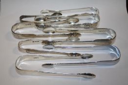 EIGHT PAIRS OF HALLMARKED SILVER SUGAR TONGS OF VARIOUS DATES AND MAKERS